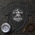 Dark t-shirt with hexagonal graphic of a poodle and the word "BOUNCE."