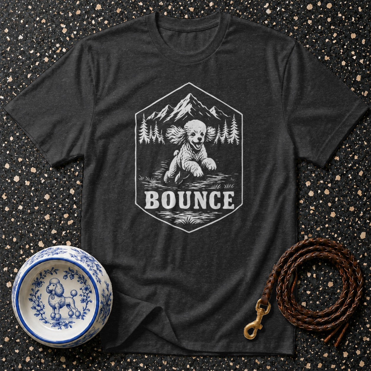 Dark t-shirt with hexagonal graphic of a poodle and the word "BOUNCE."