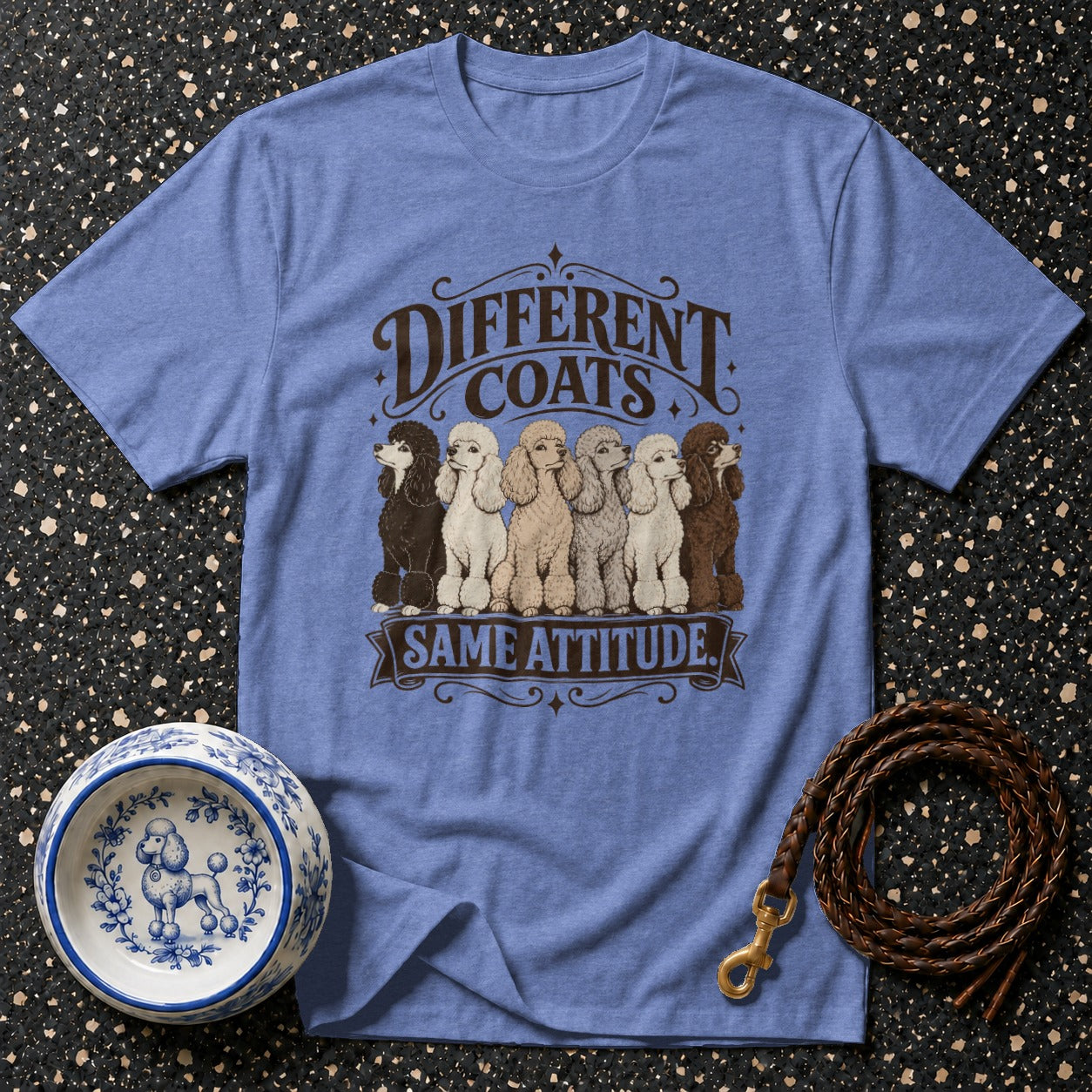 Blue t-shirt with "Different Coats Same Attitude" and poodles graphic.