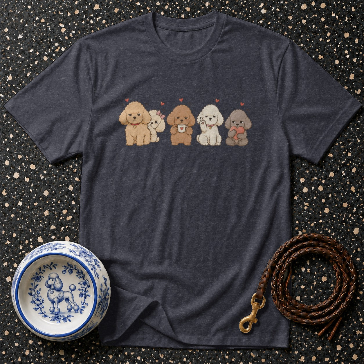 Dark gray t-shirt with a print of five poodles, a decorative dog bowl, and a leather leash.