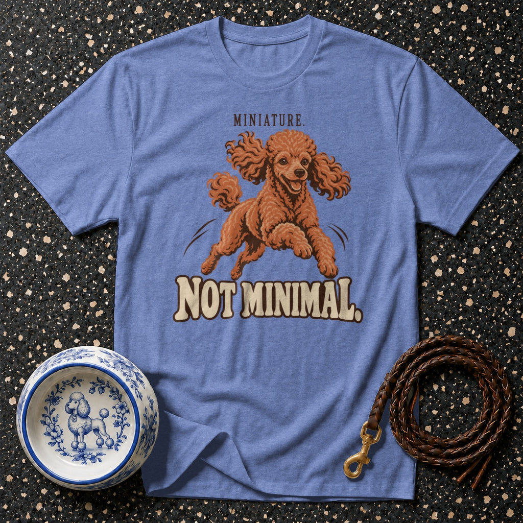 Blue t-shirt with jumping toy poodle graphic and text "MINIATURE. NOT MINIMAL."