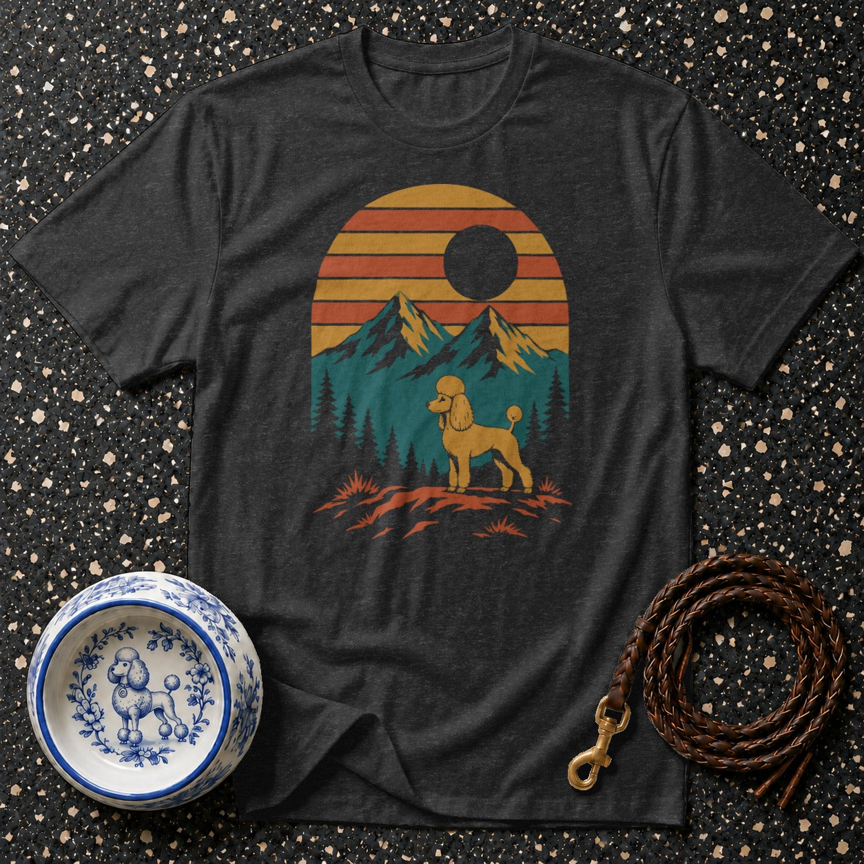 Dark gray t-shirt with a retro mountain sunset graphic featuring a golden poodle.