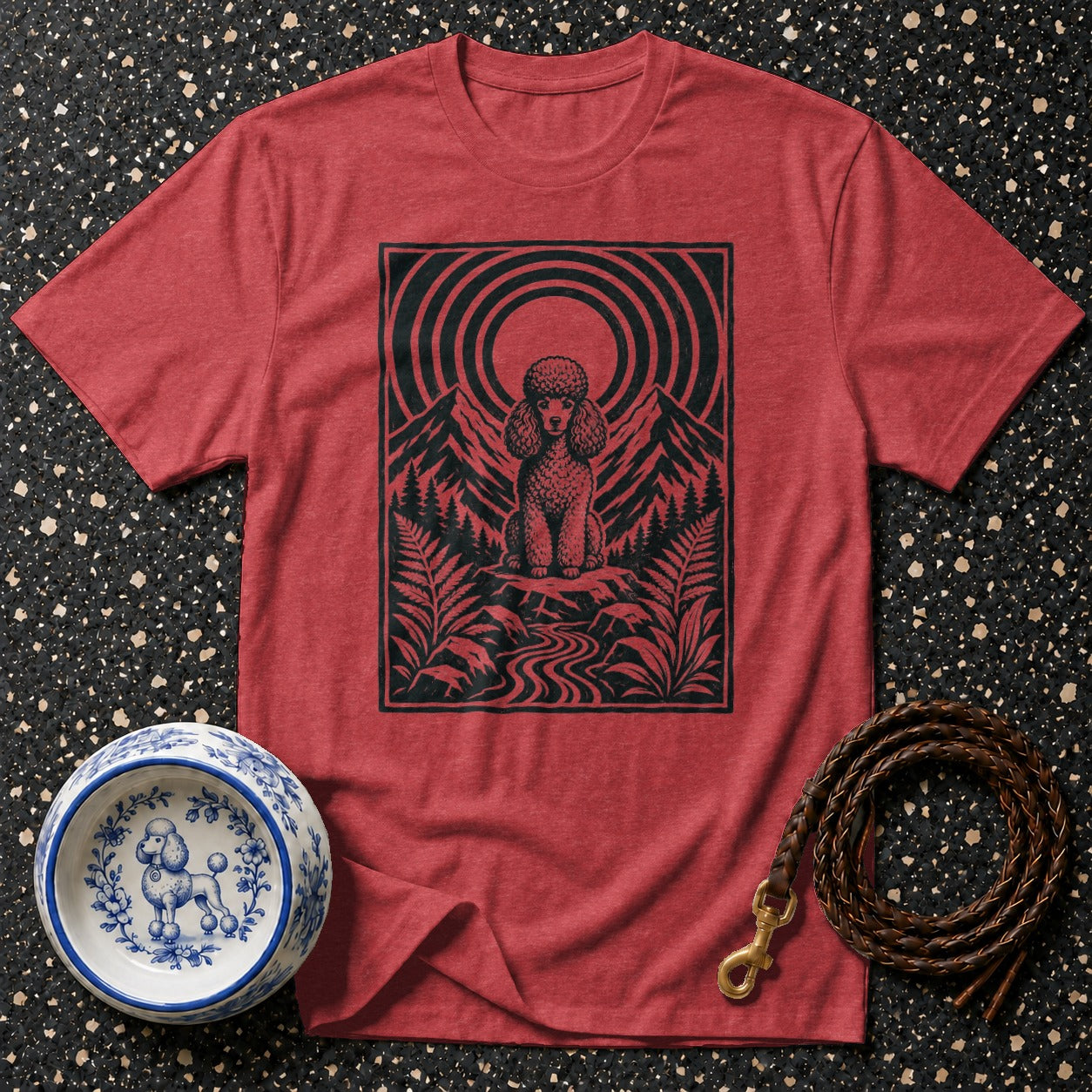Red t-shirt with black poodle and mountain landscape graphic.
