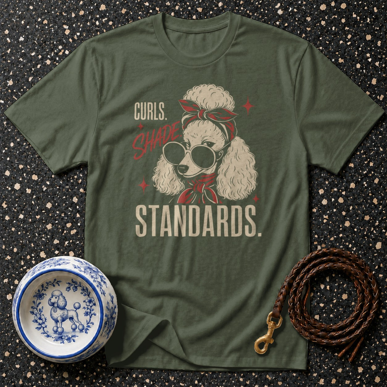 Olive green t-shirt with a poodle wearing sunglasses and bandana, text reads "Curls. Shade. Standards."