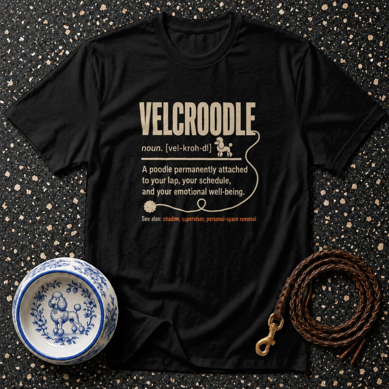 Black t-shirt with definition for "VELCROODLE" and poodle illustration.