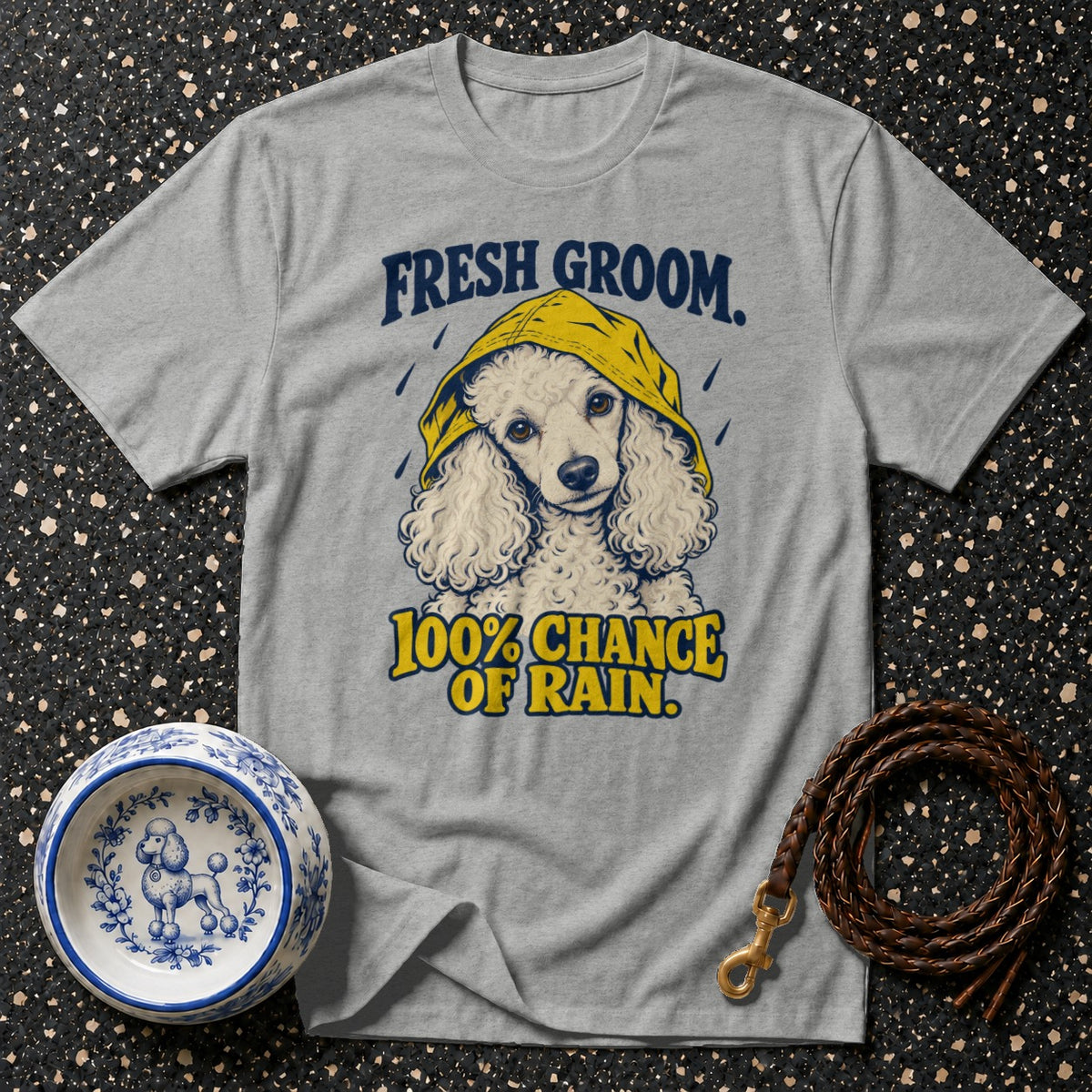 Gray t-shirt with a poodle in a yellow raincoat and text "Fresh Groom. 100% Chance of Rain."