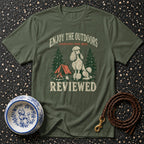 Olive green t-shirt with graphic of a poodle camping and text "ENJOY THE OUTDOORS CONDITIONS HAVE BEEN REVIEWED".