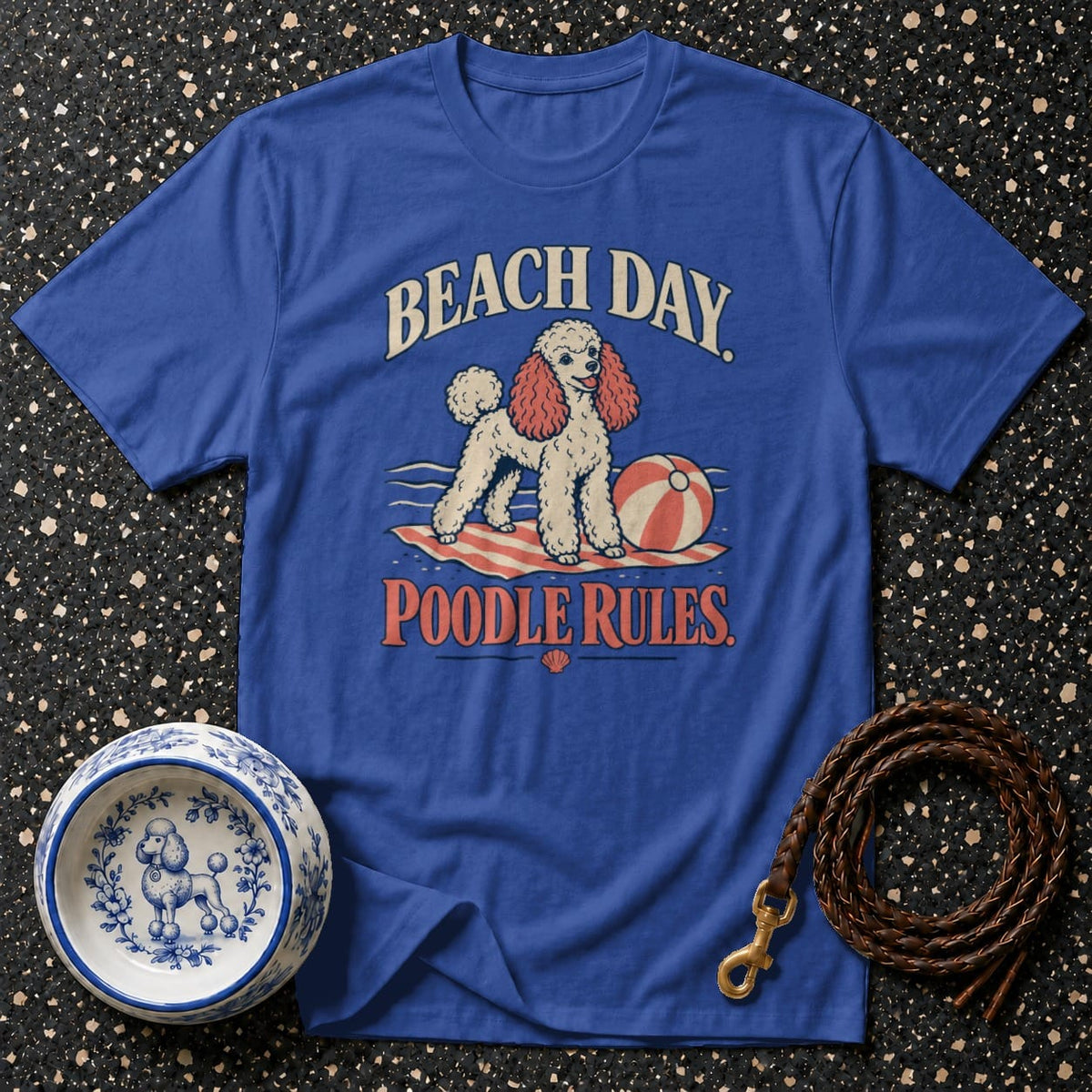 Blue t-shirt with poodle graphic, beach ball, and text "Beach Day Poodle Rules."