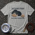 Gray t-shirt with black poodle and slippers graphic, text "The Favorite Person Has Been Selected."