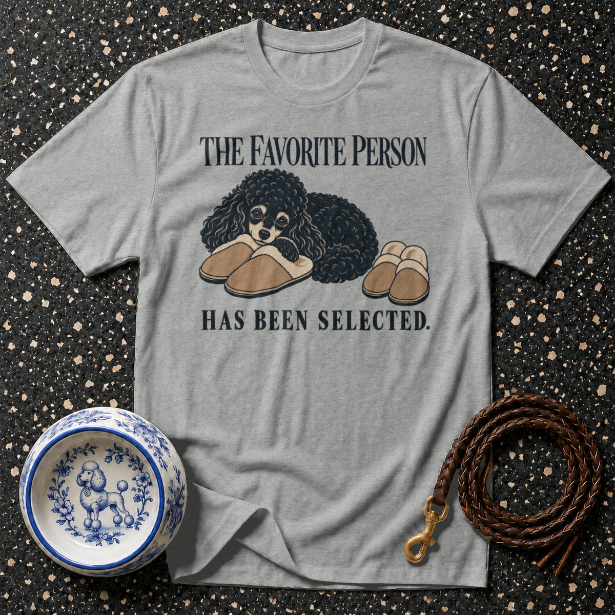 Gray t-shirt with black poodle and slippers graphic, text "The Favorite Person Has Been Selected."