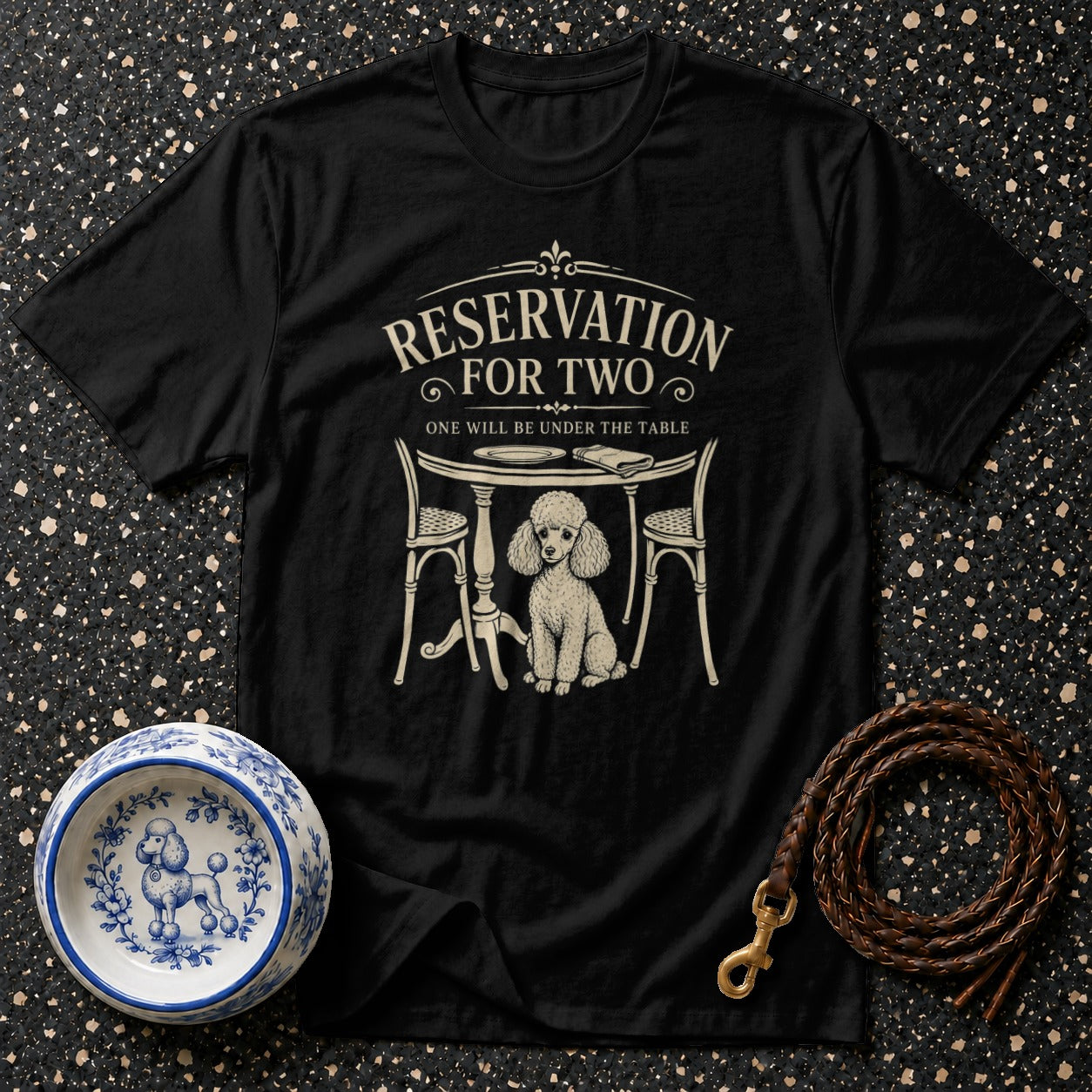 Black t-shirt with "Reservation For Two" text and poodle under a table.