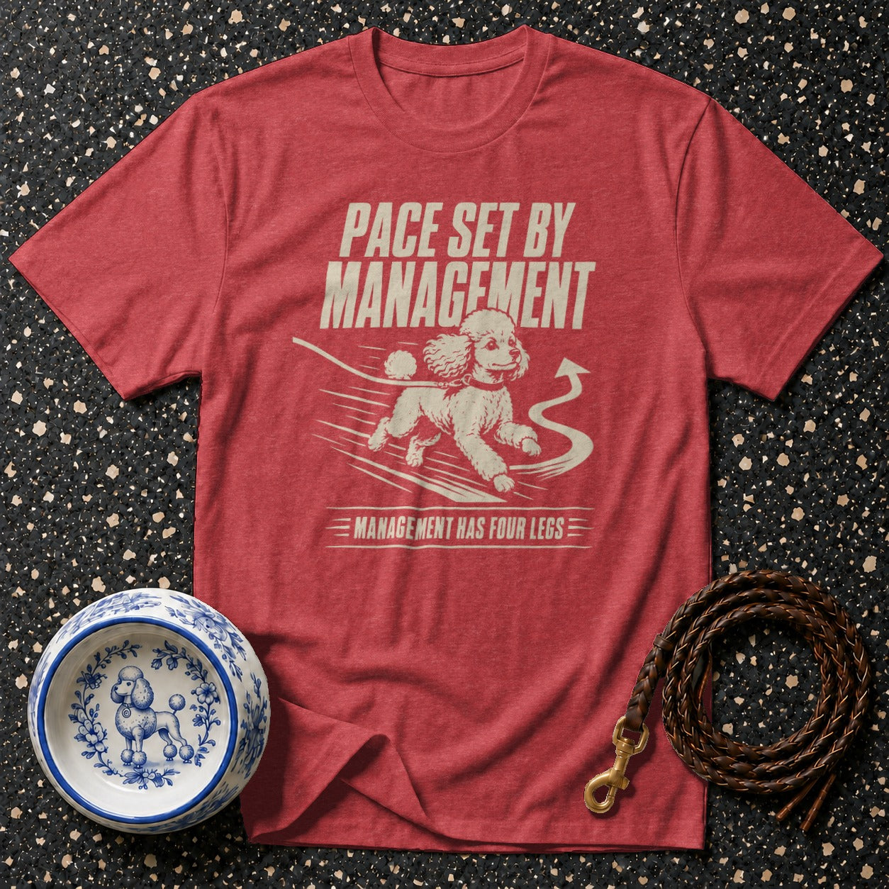 Red t-shirt with white graphic of a running poodle and text: "Pace set by management. Management has four legs."