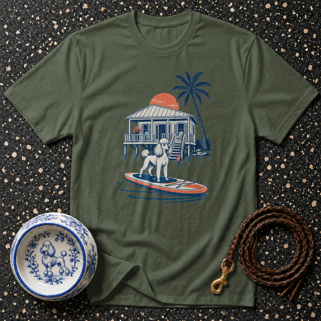 Green t-shirt with illustration of poodle on paddleboard by tropical house.