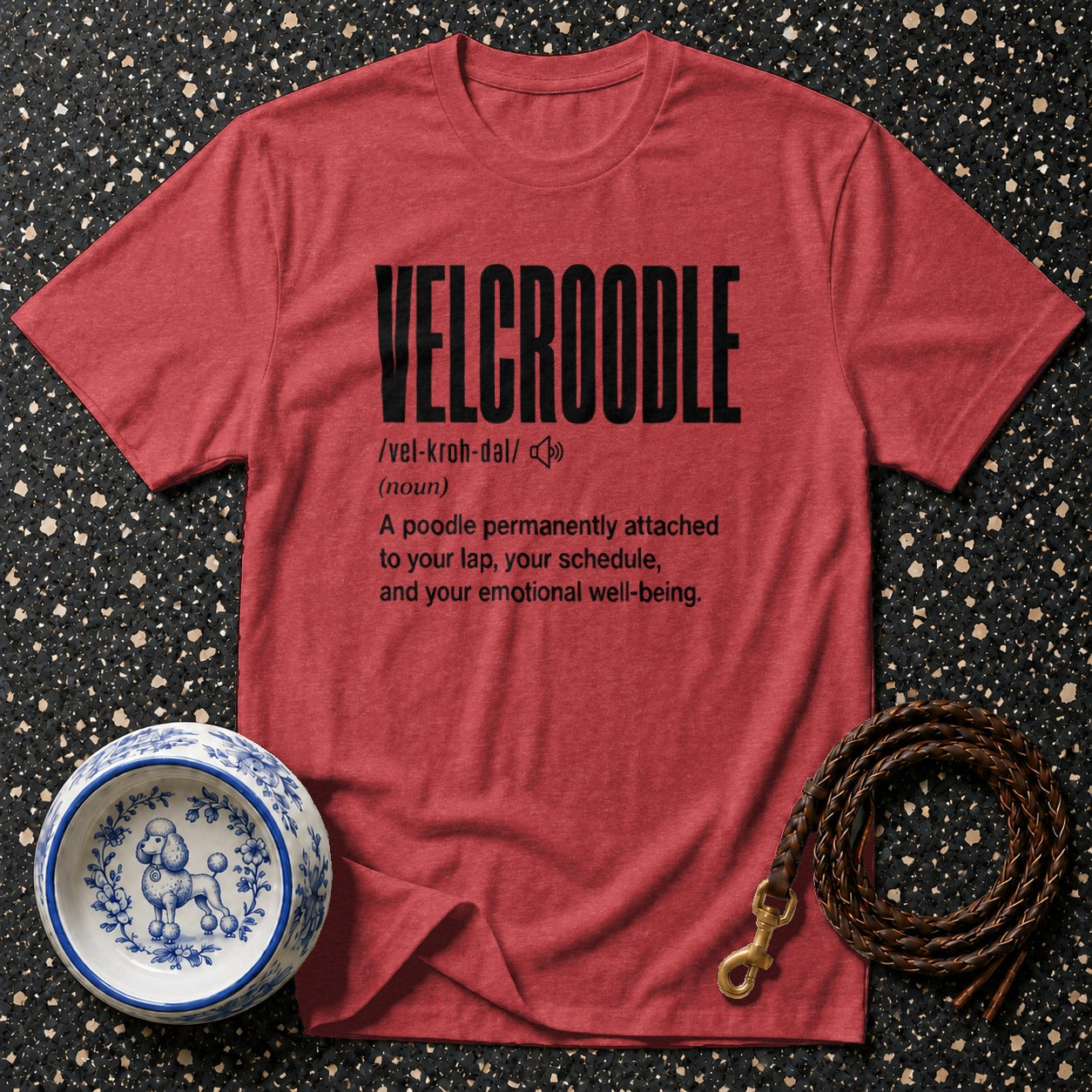 Red t-shirt with "VELCROODLE" definition and poodle dog bowl and leash.