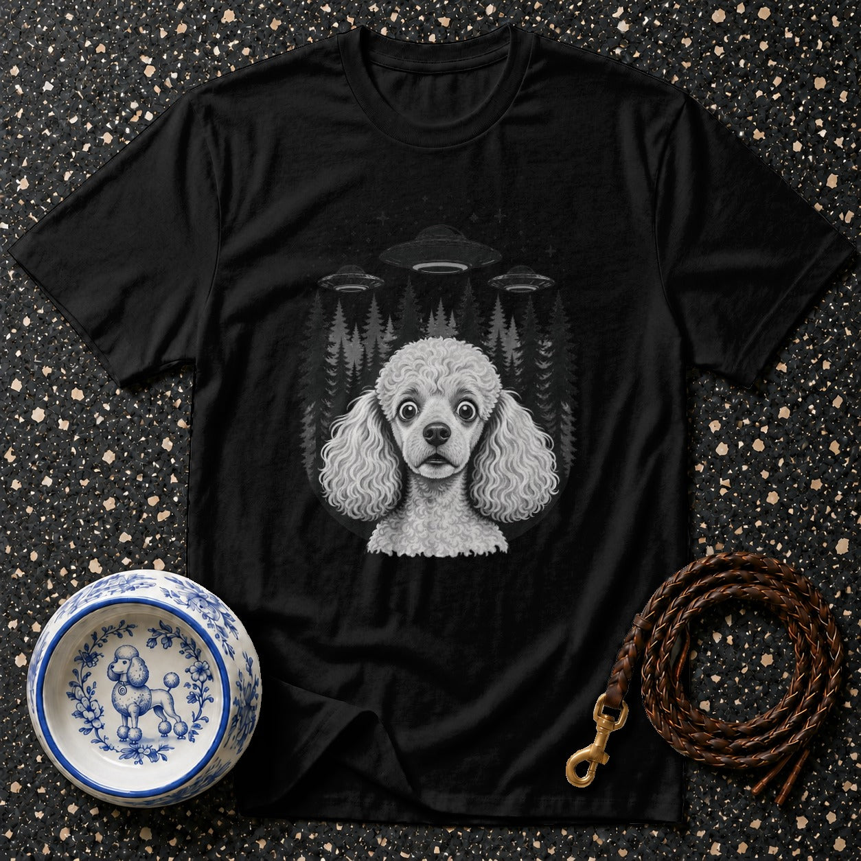 Black t-shirt with a poodle, UFOs, and forest graphic.