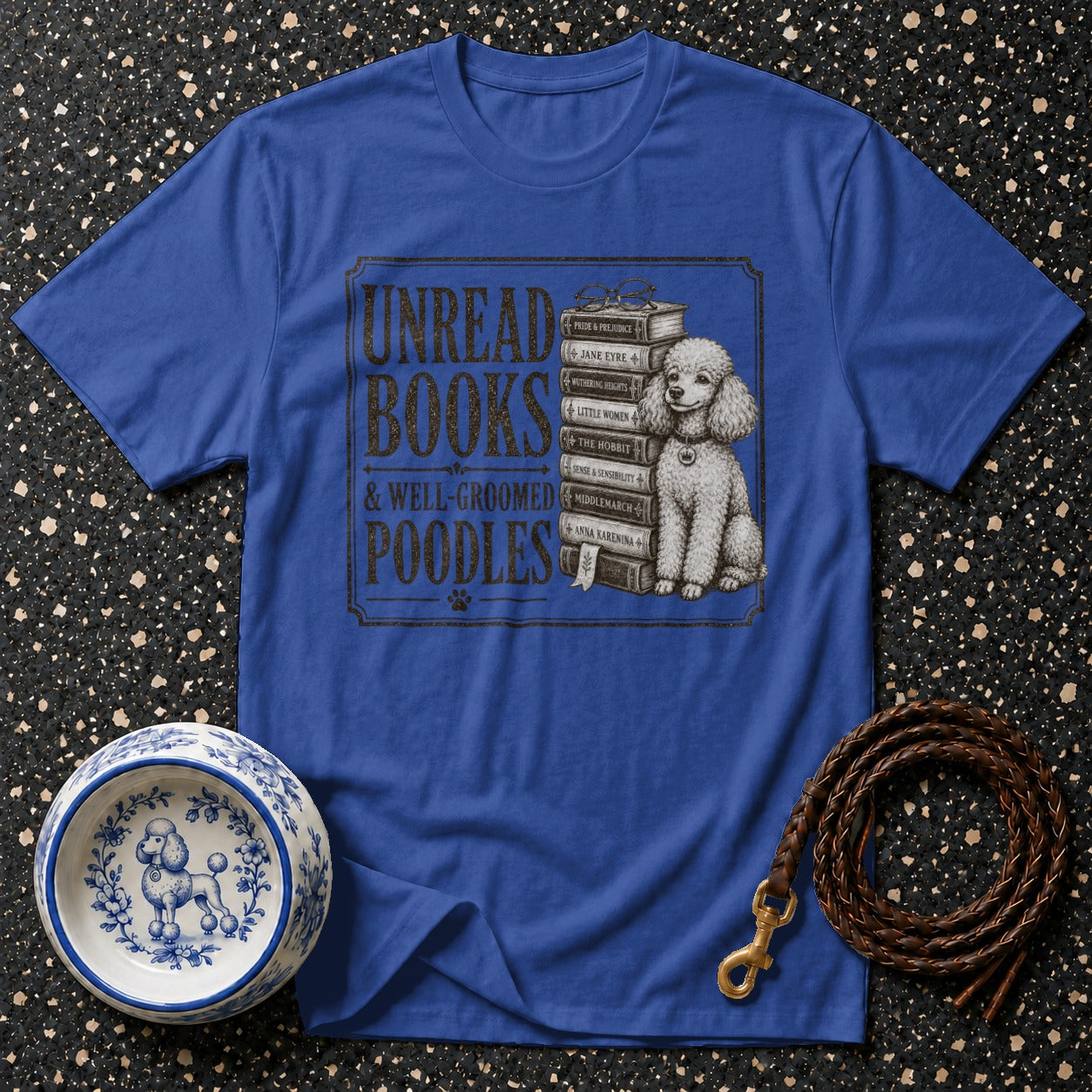 Blue t-shirt design "Unread Books & Well-Groomed Poodles" with a poodle and books.