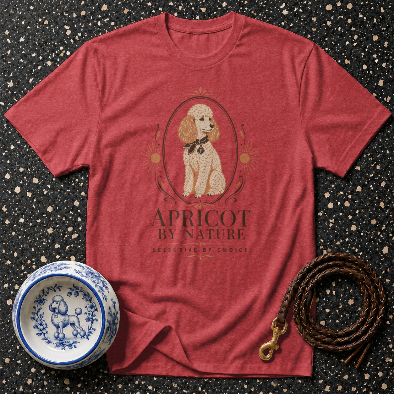 Red t-shirt with apricot poodle graphic and text "APRICOT BY NATURE".