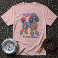 Pink t-shirt with a colorful poodle graphic and text.
