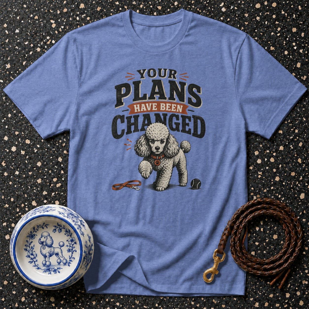 Blue t-shirt with "Your Plans Have Been Changed" text and a poodle graphic.