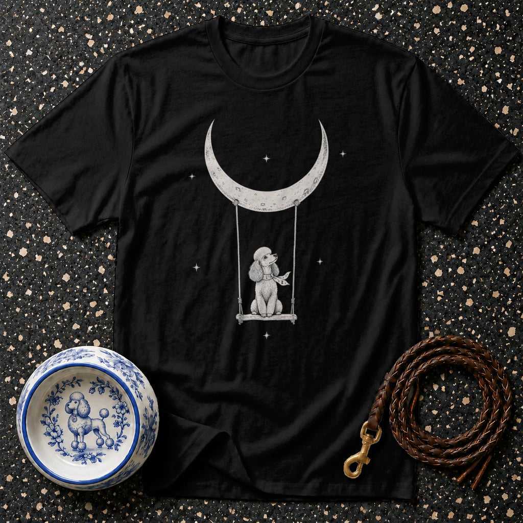 Black t-shirt with white poodle on a swing under a crescent moon.