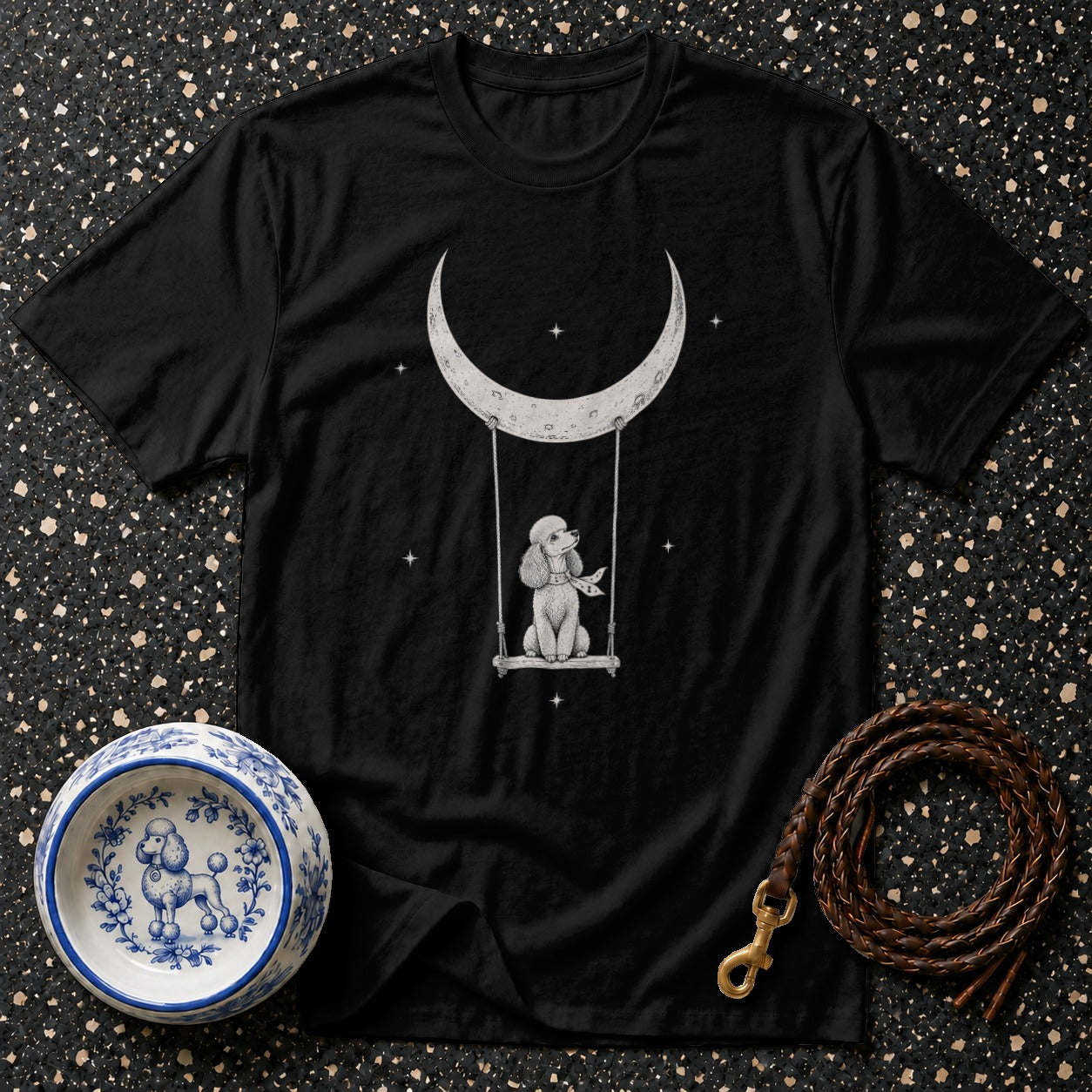 Black t-shirt with white poodle on a swing under a crescent moon.